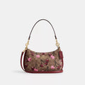 Teri Shoulder Bag In Signature Canvas
With Cherry Print